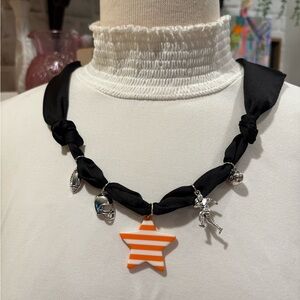 Black Necklace with Orange Star Pendant